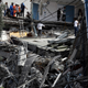 Rescue workers and volunteers search a building that collapsed after an earthquake in downtown Mexico City